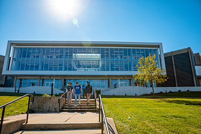 Students walking down the steps of Iowa Hall.