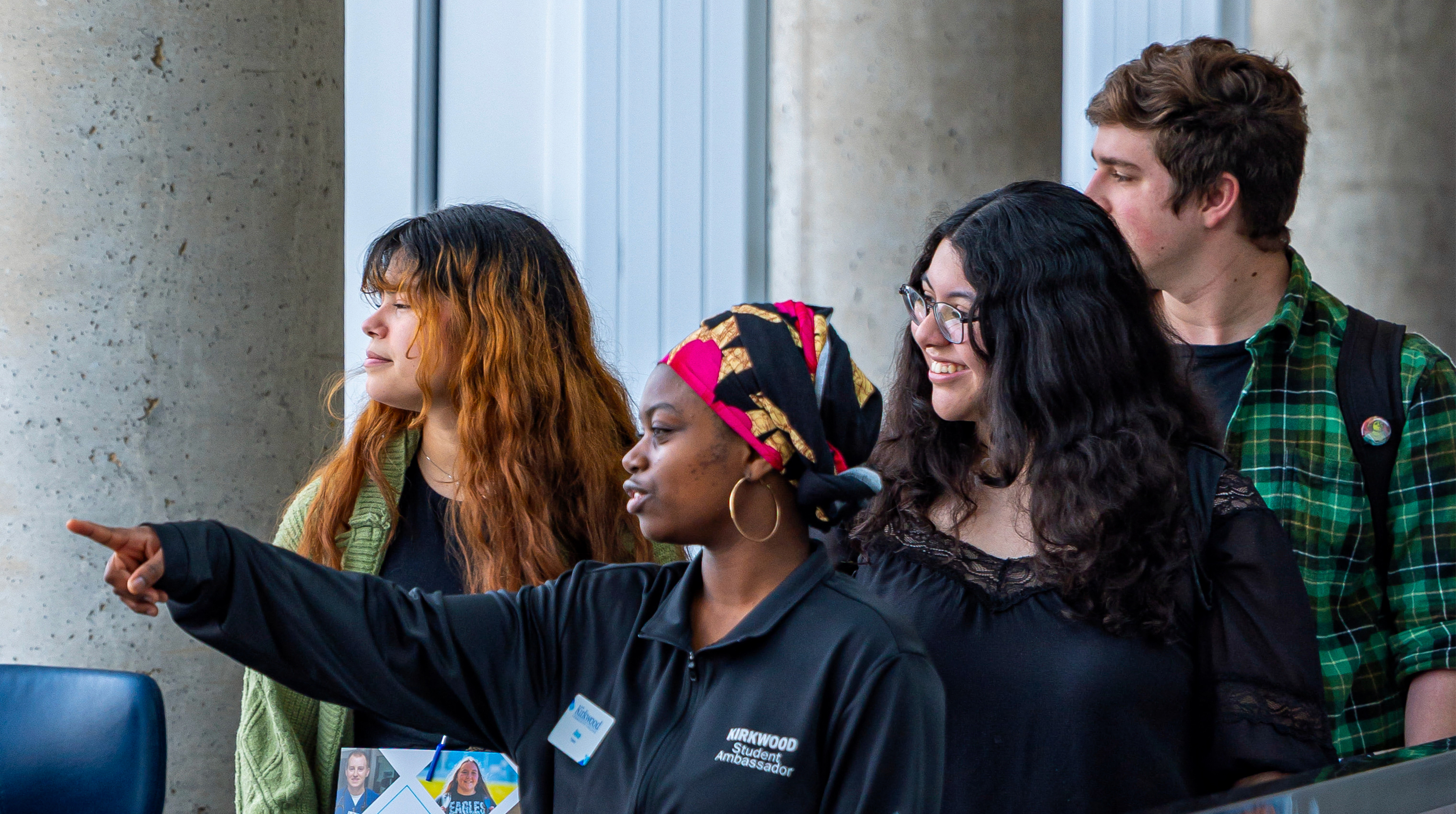 student ambassador giving a tour of campus to students